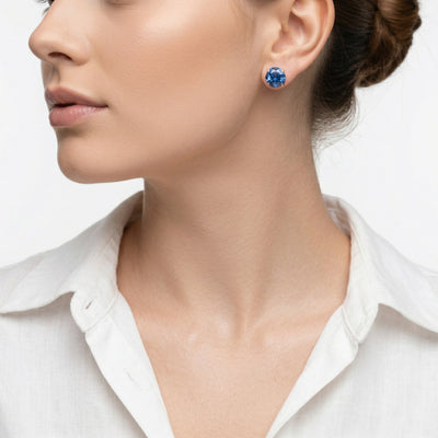 sapphire birthstone stud earrings in rose gold finish — model view