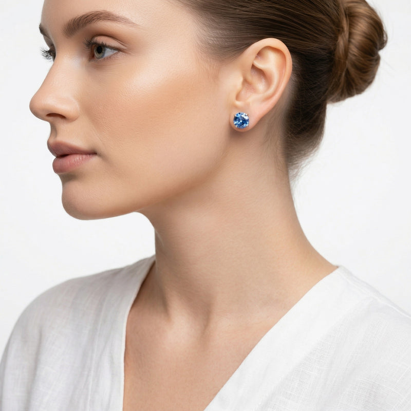 sapphire birthstone stud earrings in white gold finish — model view