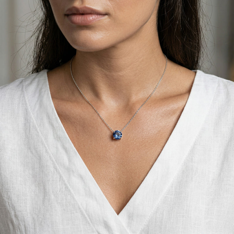 sapphire birthstone necklace in white gold finish — model view