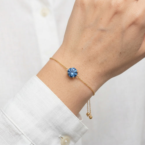 sapphire birthstone bracelet in yellow gold finish — model view