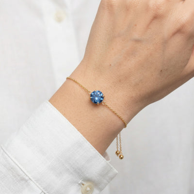 sapphire birthstone bracelet in yellow gold finish — model view