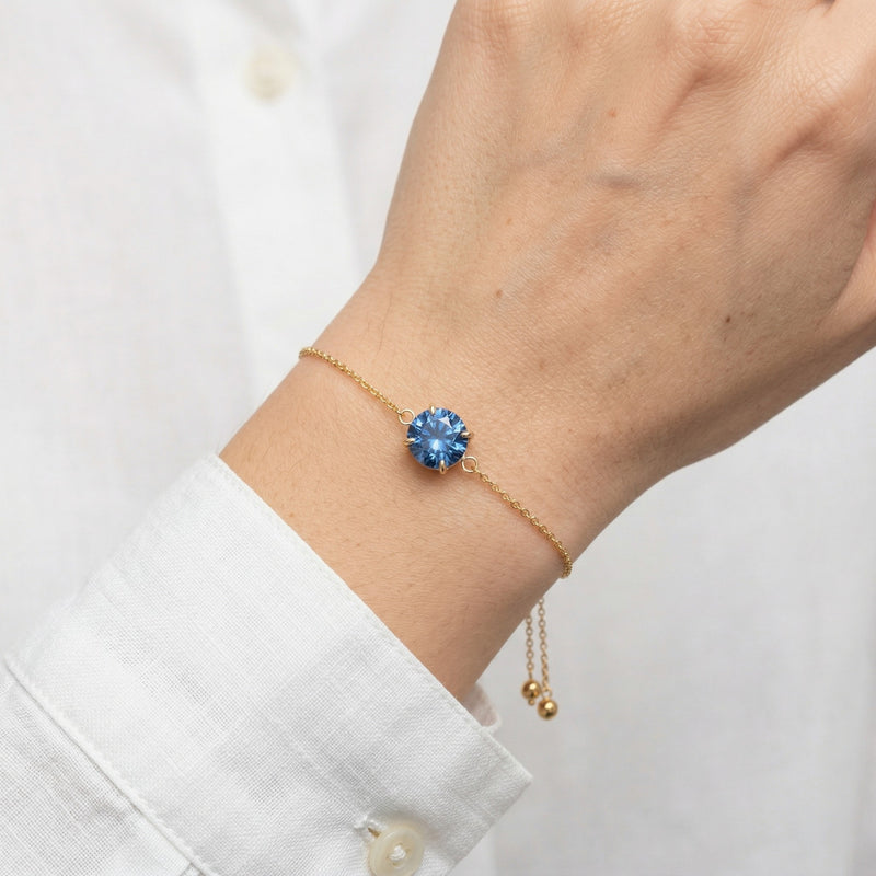 sapphire birthstone bracelet in yellow gold finish — model view