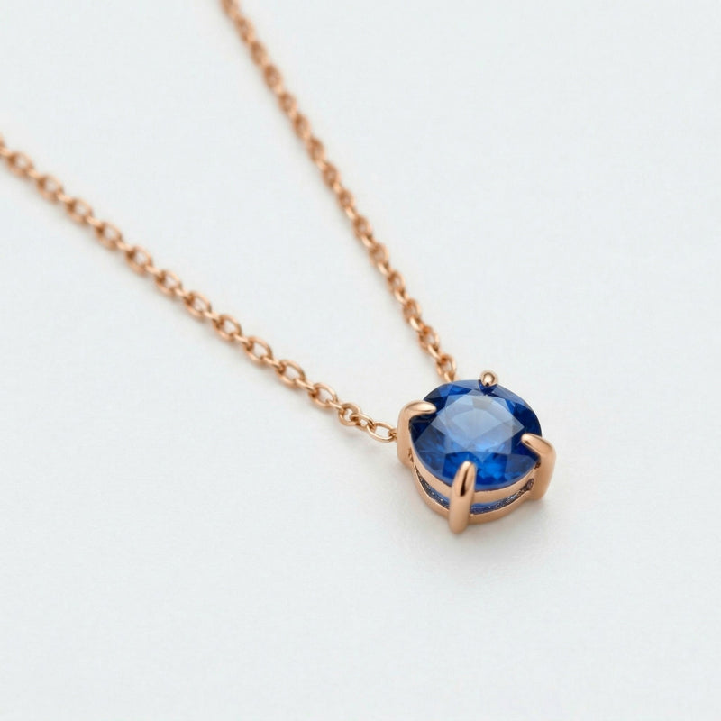 sapphire birthstone necklace in rose gold finish — side view