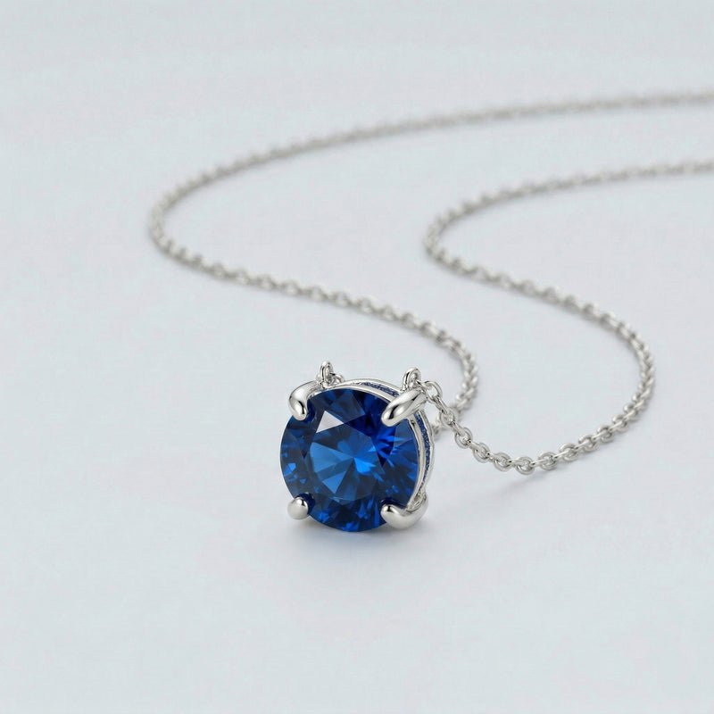 sapphire birthstone necklace in white gold finish — side view