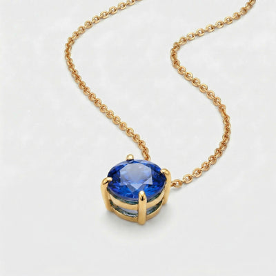 sapphire birthstone necklace in yellow gold finish — side view
