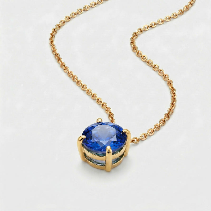 sapphire birthstone necklace in yellow gold finish — side view