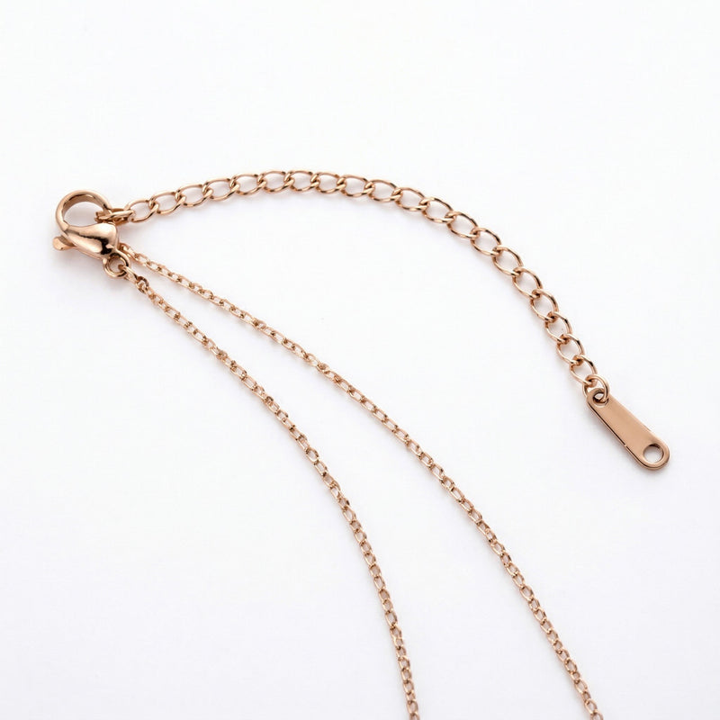 blue topaz birthstone necklace in rose gold finish — back view