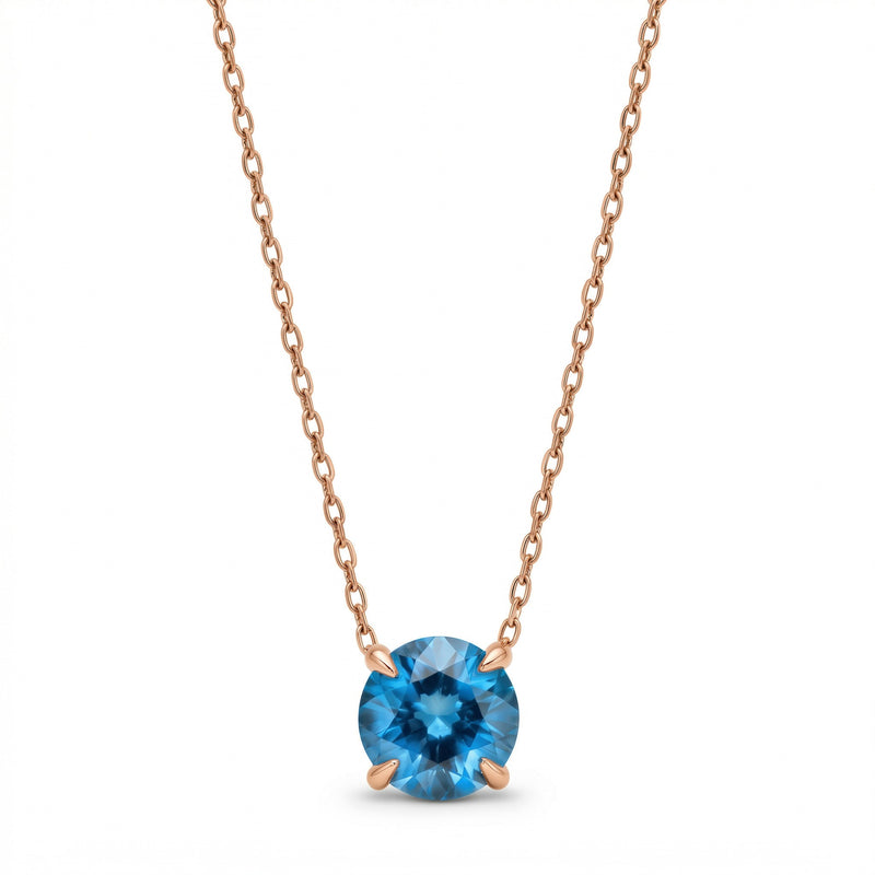 blue topaz birthstone necklace in rose gold finish — front view