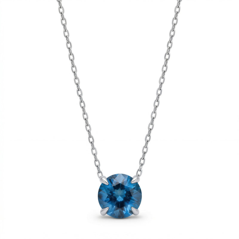 blue topaz birthstone necklace in white gold finish — front view