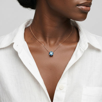 blue topaz birthstone necklace in rose gold finish — model view