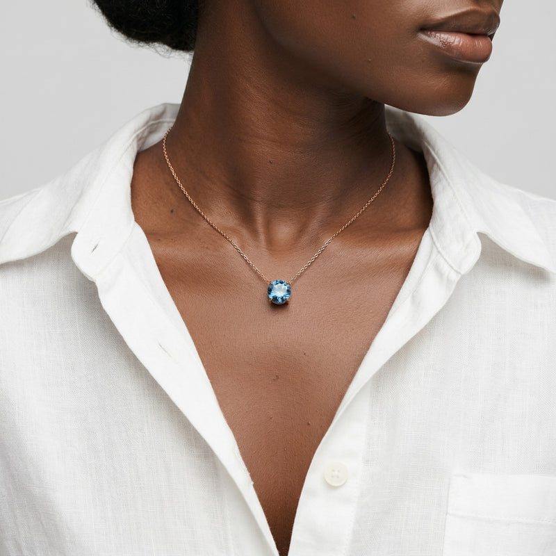 blue topaz birthstone necklace in rose gold finish — model view