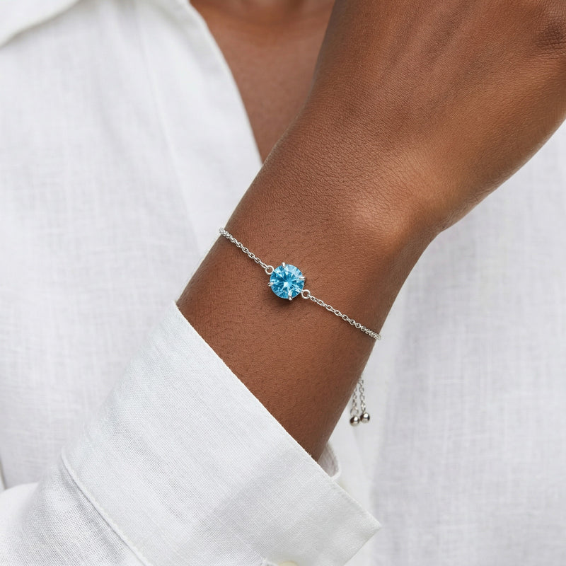 blue topaz birthstone bracelet in white gold finish — model view