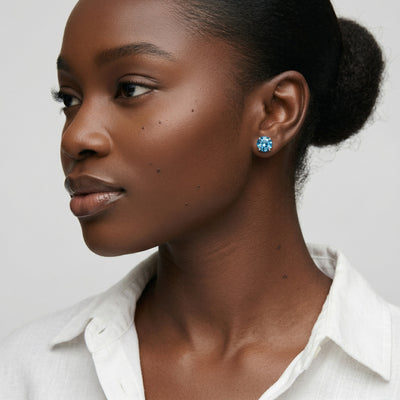 blue topaz birthstone stud earrings in white gold finish — model view