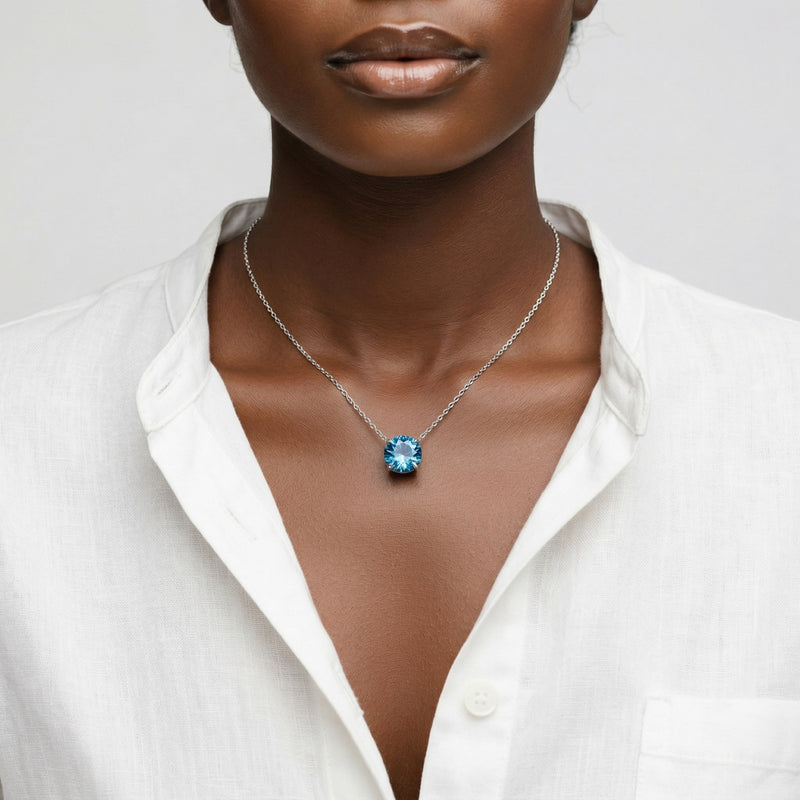 blue topaz birthstone necklace in white gold finish — model view