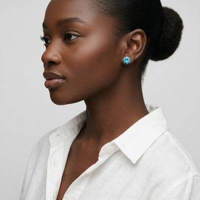 blue topaz birthstone stud earrings in yellow gold finish — model view
