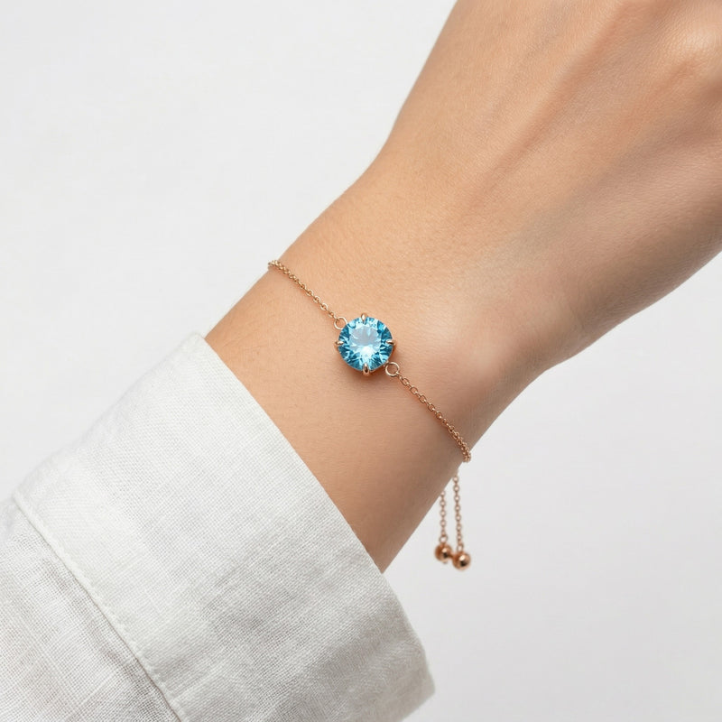 blue topaz birthstone bracelet in rose gold finish — model view
