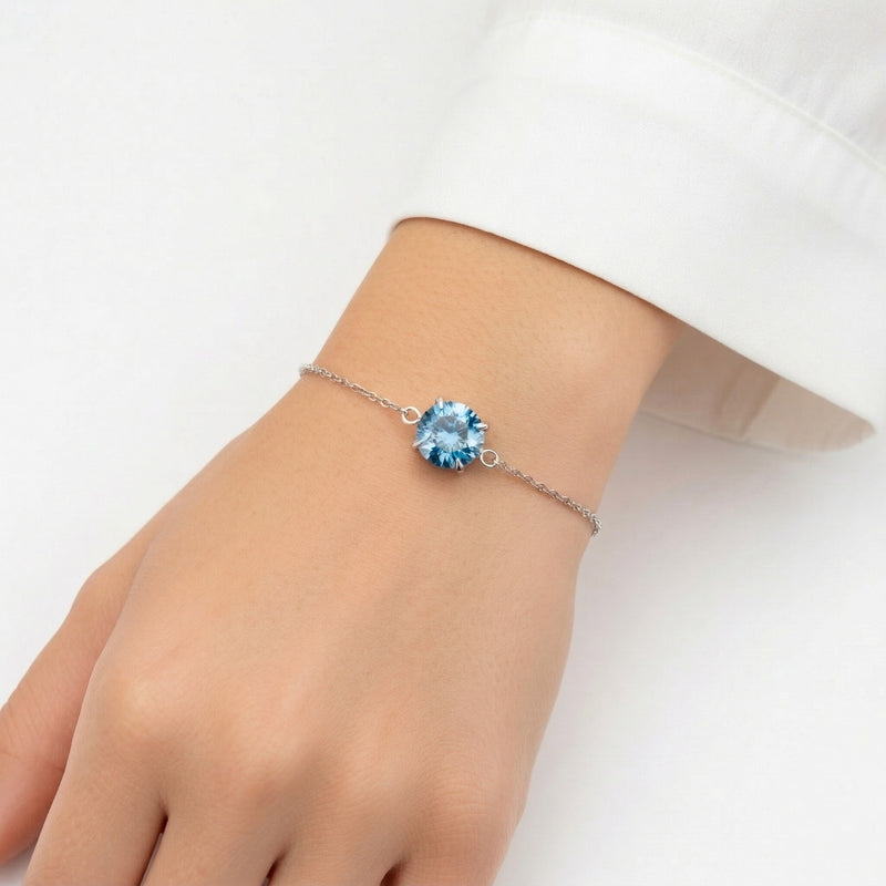blue topaz birthstone bracelet in white gold finish — model view