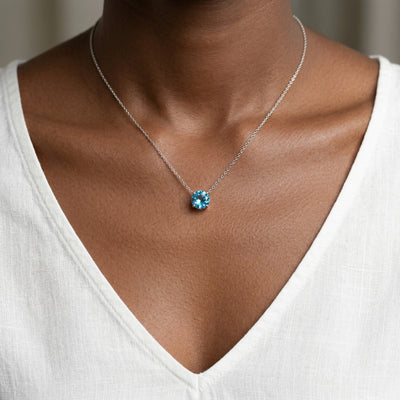 blue topaz birthstone necklace in white gold finish — model view