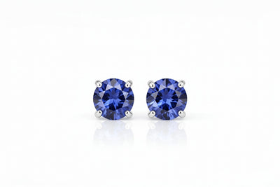tanzanite birthstone stud earrings in white gold finish — front view