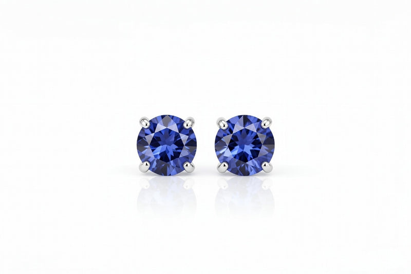 tanzanite birthstone stud earrings in white gold finish — front view