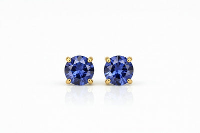 tanzanite birthstone stud earrings in yellow gold finish — front view