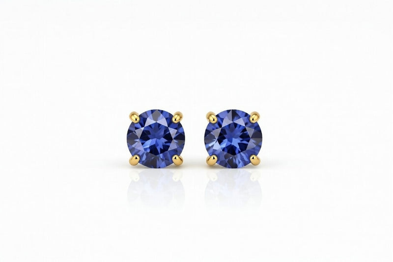 tanzanite birthstone stud earrings in yellow gold finish — front view