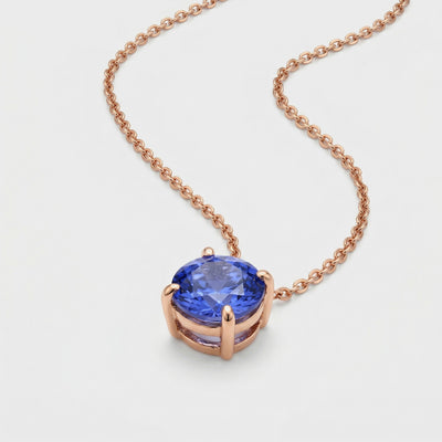 tanzanite birthstone necklace in rose gold finish — side view