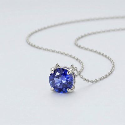 tanzanite birthstone necklace in white gold finish — side view