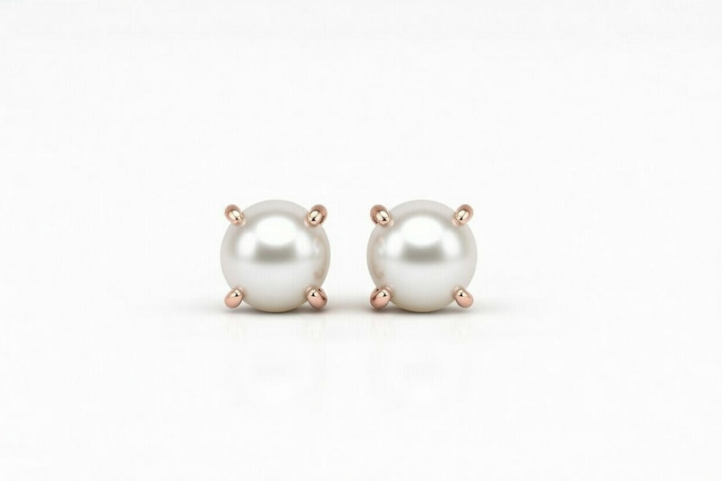 pearl birthstone stud earrings in rose gold finish — front view