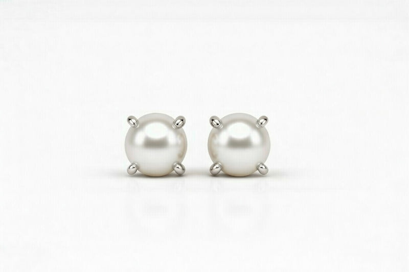 pearl birthstone stud earrings in white gold finish — front view