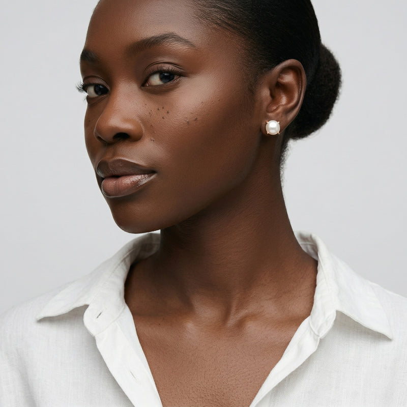 pearl birthstone stud earrings in rose gold finish — model view