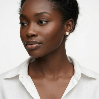 pearl birthstone stud earrings in yellow gold finish — model view