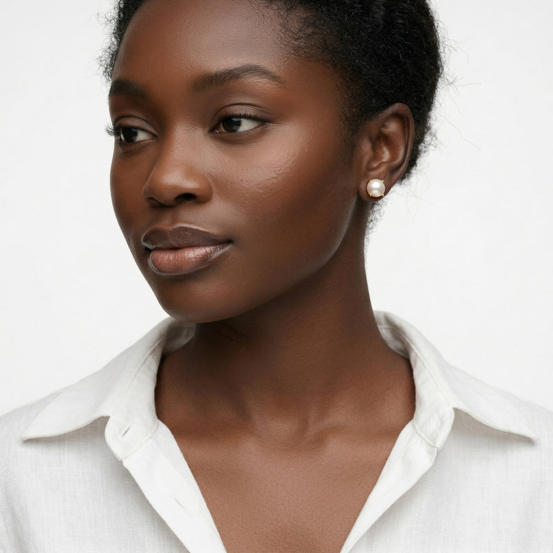 pearl birthstone stud earrings in yellow gold finish — model view