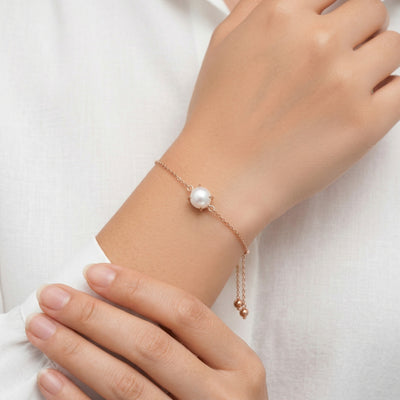 pearl birthstone bracelet in rose gold finish — model view