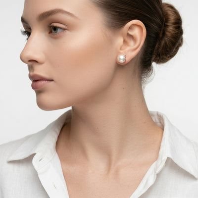 pearl birthstone stud earrings in rose gold finish — model view