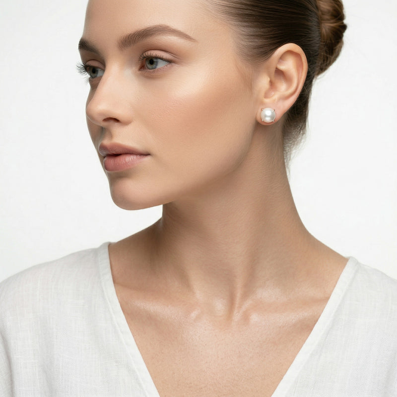 pearl birthstone stud earrings in white gold finish — model view