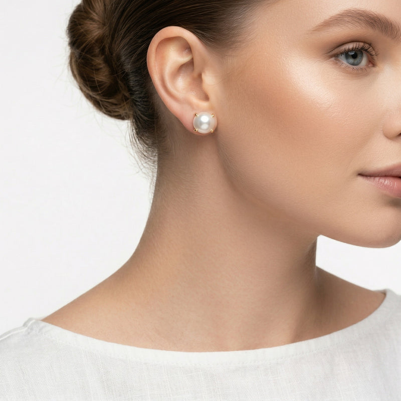 pearl birthstone stud earrings in yellow gold finish — model view