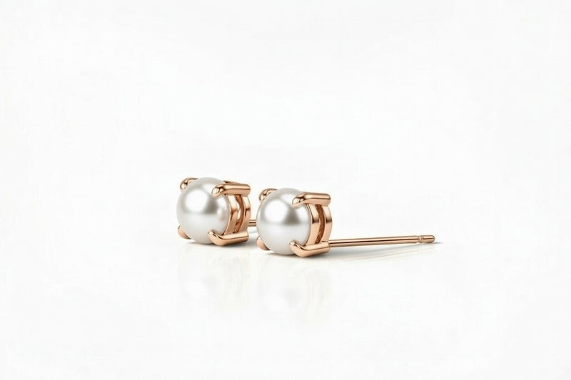 pearl birthstone stud earrings in rose gold finish — side view