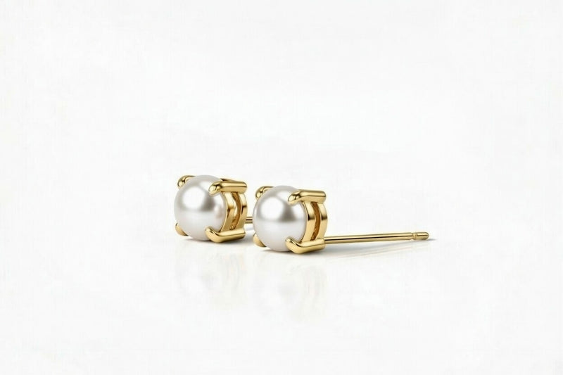 pearl birthstone stud earrings in yellow gold finish — side view