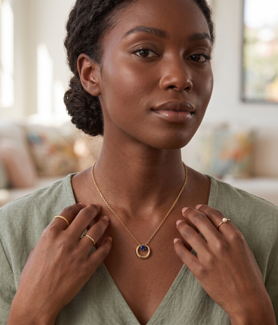 blue sapphire twisted circle pendant necklace in yellow gold finish — model view