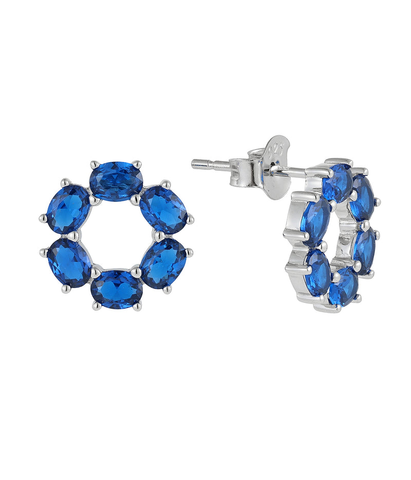 blue sapphire circle stud earrings in white gold finish — front view