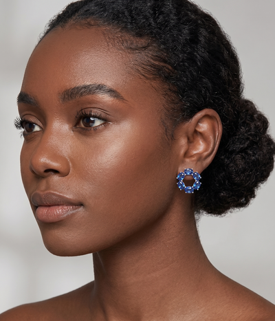 blue sapphire circle stud earrings in white gold finish — model view