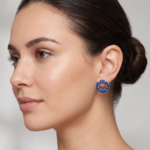 blue sapphire circle stud earrings in white gold finish — model view
