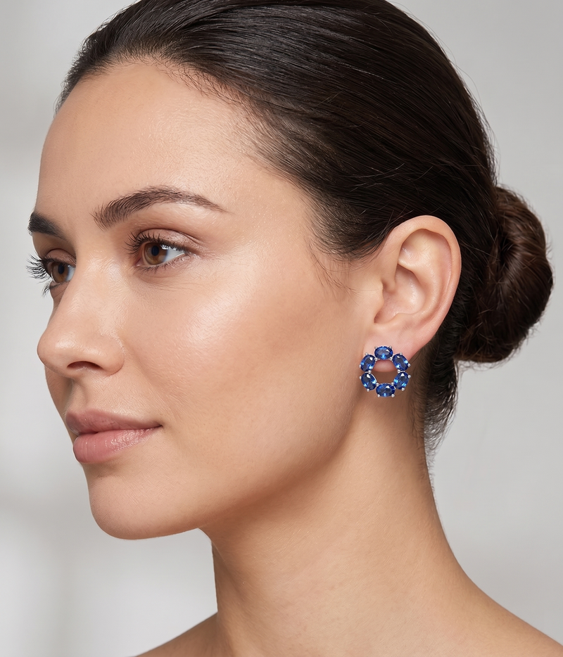 blue sapphire circle stud earrings in white gold finish — model view