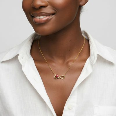 garnet birthstone necklace in yellow gold finish — model view