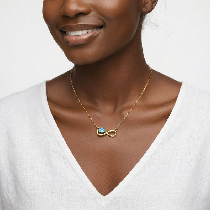 aquamarine birthstone necklace in yellow gold finish — model view