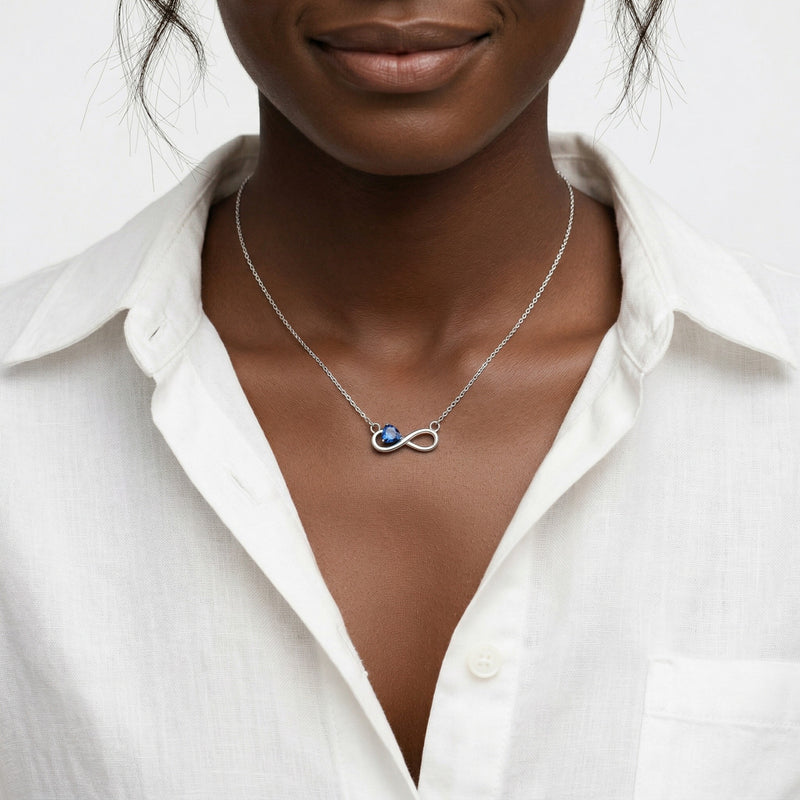 sapphire birthstone necklace in white gold finish — model view