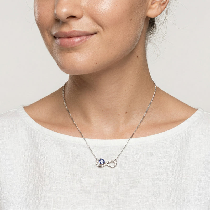 sapphire birthstone necklace in white gold finish — model view