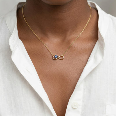sapphire birthstone necklace in yellow gold finish — model view