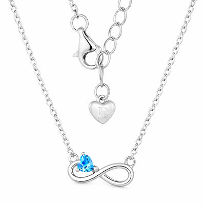 blue topaz birthstone necklace in white gold finish — back view